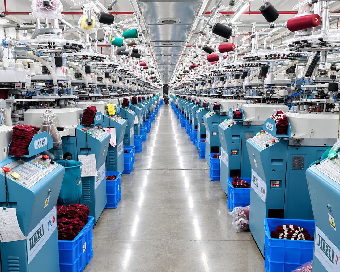 Sock knitting machines on the Leiqing Knitting factory floor in Zhuji